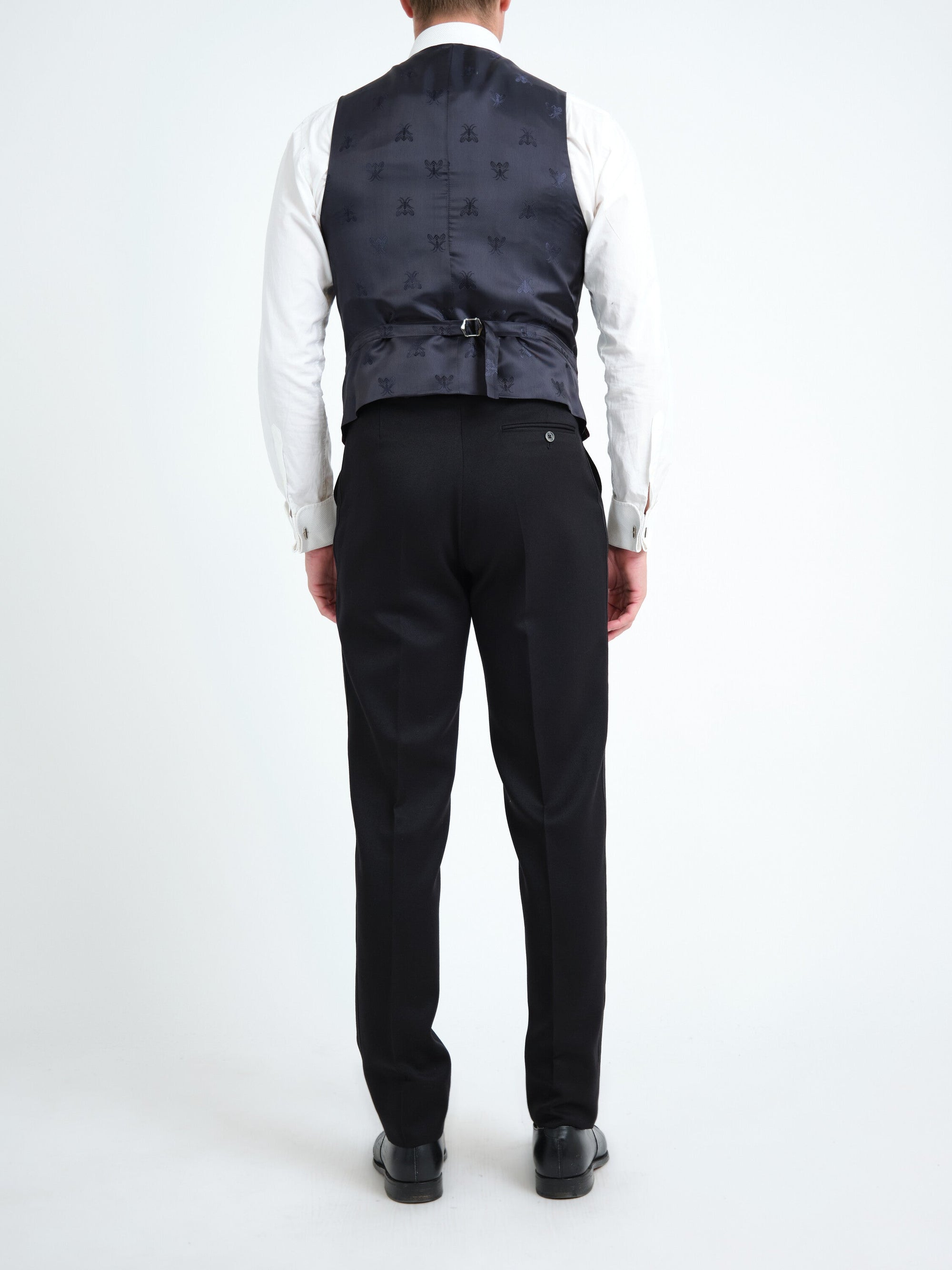 Burgundy velvet single-breasted waistcoat — back, navy bee-patterned lining