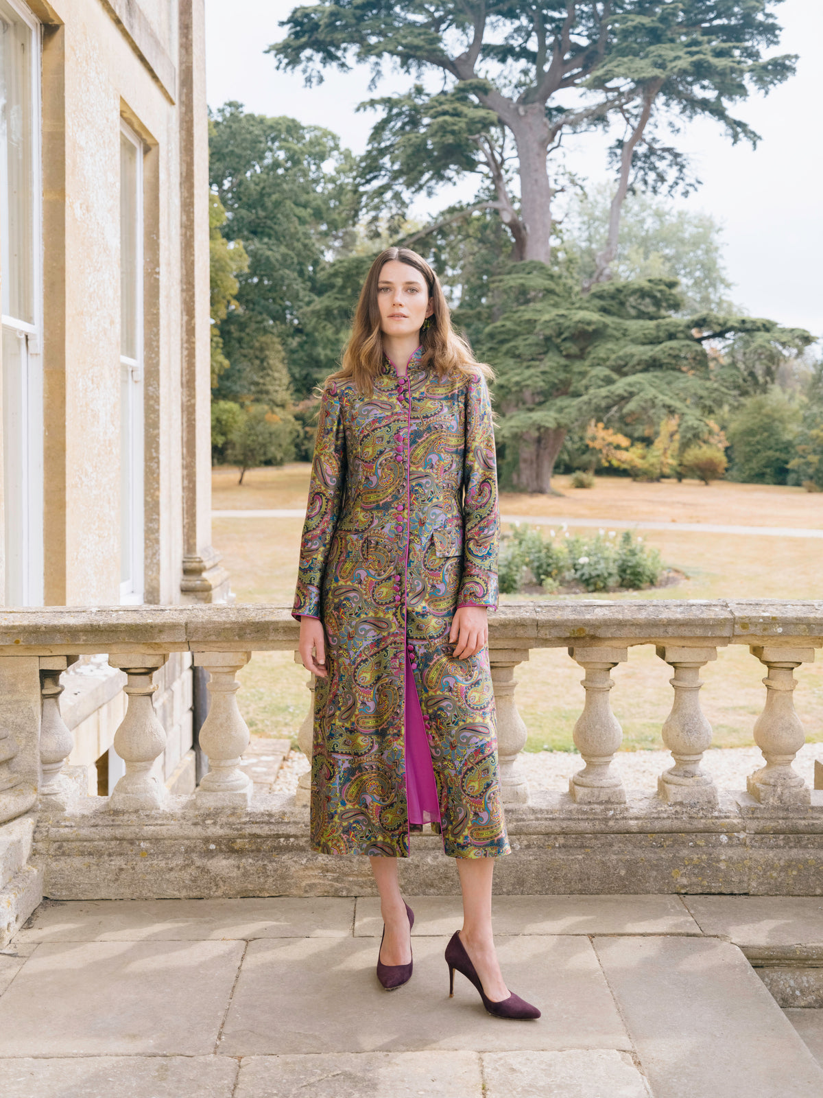 A paisley silk coat over a pink dress, three quarter view